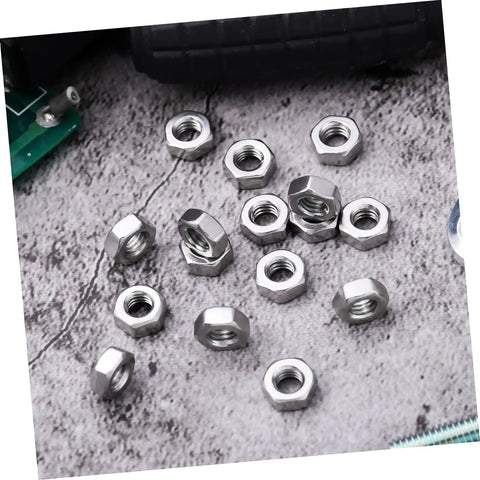 250Pcs Stainless Steel Hex Nuts And Machine Fasteners Pack Shop Drawer Staple For Garage Fixes And Weekend Builds Heavy Duty Metric M4 Hardware built for durability on a concrete surface.
