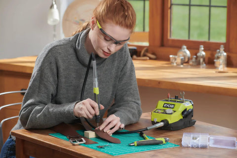 Badass 18 Volt Cordless Mini Rotary Tool With 35 Premium Accessories For Ultra Fast Diy Engraving Polishing And Precision Sanding Projects in use on leather