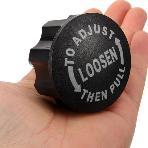 Upgrade Your Ride With These Killer Pull Pin Spring Knobs For Exercise Bikes And Cycling Machines Featuring A Solid 18mm Thread Design Made From Durable Abs Plastic And Iron To Keep Your Indoor Fitness Gear Locked In Tight And Ready For Intense Workouts. Black adjustable pull knob held in a hand for exercise bike adjustment.