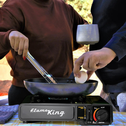 Dual Fuel Gas Camping Stove For Butane Or Propane, Portable Single Burner With people cooking outdoors