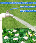 Side view of 3/4 in stainless steel hose bibb with blue lever handle, water spraying from outdoor spigot