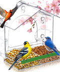Epic Window Bird Feeder with five extra strong suction cups, clear material, filled with seeds and mealworms, birds perched