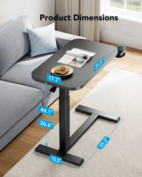 32 Inch On Wheels Overbed Desk With Cup Holder And Height Adjustable Pneumatic Lift Rolling Computer Cart next to sofa