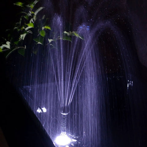 Grade A 132 GPH Solar Fountain Pump And Panel Kit built with dependable battery pack and bright LED light in operation at night.