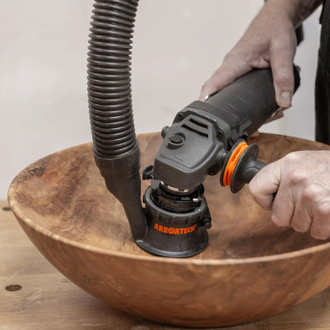 Heavy Duty Power Carving Tool Attachment Featuring A Slick Two Inch Cutting Disc And Adjustable Sanding System in use on wood bowl.
