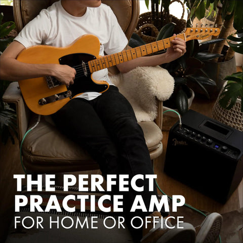 Mustang LT25 Guitar Amplifier 25 Watt Digital Modeling Combo Amp With 8 Inch Speaker next to person playing guitar