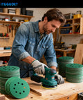 Ditch cheap discs and grab these 50 pc 5-inch sanding discs with 8 holes being used on a wood project with a power sander.