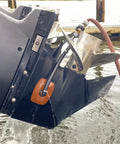 Heavy Duty Steel Boat Motor Flusher With Dual Flow Muff Style Five Eighths Inch Garden Hose Connection attached to boat motor
