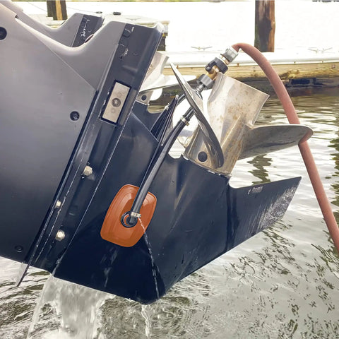 Heavy Duty Steel Boat Motor Flusher With Dual Flow Muff Style Five Eighths Inch Garden Hose Connection attached to boat motor