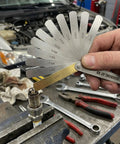 Stainless steel feeler gauge set with 32 blades (0.04–0.88 mm) for spark plug gap measurement
