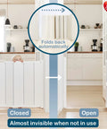 Child standing behind Guard Me Retractable Safety Gate for Extra Wide Openings 21.6 to 44.6 Inches in a kitchen setting