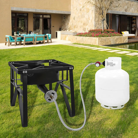 Outdoor propane regulator with 48-inch stainless braided hose connected to a black metal grill burner frame beside a white propane tank