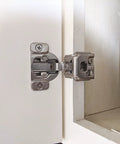 Smooth As Butter Soft Close Cabinet Hinges With 3 Way Cam Adjustment 1 1/4 Overlay And 105 Degree Open installed on a white cabinet.
