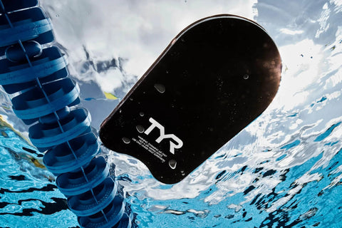 Classic Swim Kickboard For Training And Pool Workouts, All Ages, Durable Foam Kickboard in water near lane divider