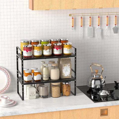Expandable Cabinet Storage Shelf Organizer Rack Built Tough And A Real Workhorse Heavy Duty Steel Stackable For Kitchen Pantry Garage Spice Rack, Adjustable Height, Fits Counters Desks And Cabinets, Black 1 Pack filled with spice jars on a kitchen counter.