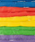 Colorful nylon round slings stacked, including endless round sling 12 foot red with hook combo 13,200 lbs WLL for crane rigging.