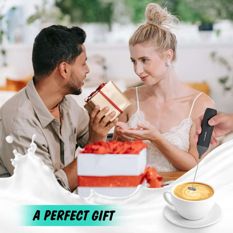 Rechargeable Milk Frother Wand Handheld Electric Foam Maker With USB C Power Detachable Stainless Steel Whisk For Coffee Latte Cappuccino Matcha No Stand Travel Ready Black shown in gift setting with a coffee cup and a couple exchanging gifts