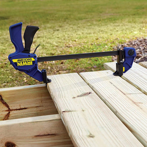 One Handed Bar Clamp Set 12 Inch Medium Duty Five Pack With Quick Change Button used on wooden planks outdoors