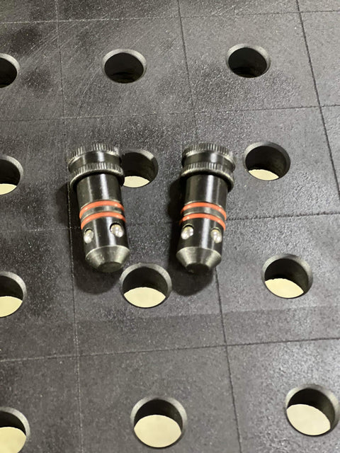 Five Eighths Inch Quick Release Ball Lock Pins For Modular Welding Fixture Tables Two Pack on perforated surface