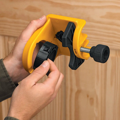 Hands adjusting yellow and black door lock installation kit with C-clamp design, for metal or wood doors, showing tool-free clamping.