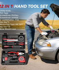 Person using 22-in-1 hand tool set to repair car engine with tools like utility knife, screwdrivers, and pliers visible in open case.