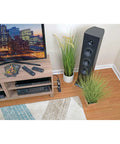 Room setup with TV and Six Outlet Surge Protector Power Strip with Six Foot Cord Black No Brainer Lifetime Guarantee And Ten Thousand Insurance Coverage for Home And Office Gear behind TV stand