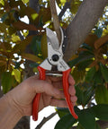 Hand using Go-To MaxForged 1-Inch Bypass Pruner With Forged Steel Blade And Replaceable Edge on tree branch