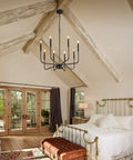 Bedroom with eight light black industrial candle chandelier for dining room and kitchen island, farmhouse rustic pendant.