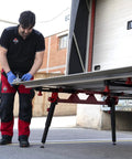 Heavy Duty Adjustable Tile Table For Large Format Ceramic Sheets Extending 43 To 59 Inches being used by a contractor.
