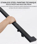 Close view of hand gripping four-foot aluminum handrail kit featuring a matte black finish for stairs and safety.