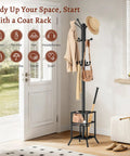 Freestanding Coat Rack With Umbrella Holder And 12 Metal Hooks Three Tier Tree Coat Stand in a bright entryway.