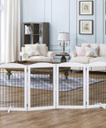 Free Standing Foldable Wire Dog Gate With Four Panels Extra Wide 80 Inch Span And 30 Inch Tall Safety Fence For Doorways Stairs And Rooms Includes Support Feet White in a living room setting.