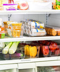 Ultimate Six Piece Fridge Organizer And Pantry Storage Bin Set Featuring Wide Narrow Containers Clear Can Caddy For Twelve Drinks Plus Egg Holder To Straight Up Declutter Your Space with veggies and drinks.