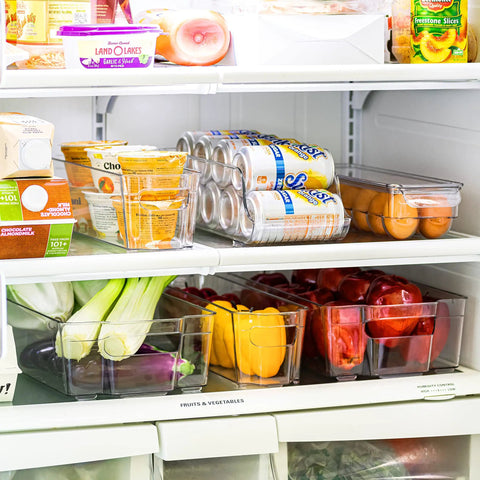 Ultimate Six Piece Fridge Organizer And Pantry Storage Bin Set Featuring Wide Narrow Containers Clear Can Caddy For Twelve Drinks Plus Egg Holder To Straight Up Declutter Your Space with veggies and drinks.