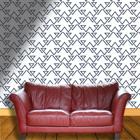 Light Neutral Peel And Stick Wallpaper Roll Heavy Duty Textured Vinyl Self Adhesive Wallcovering No Fuss Room Refresh with geometric pattern behind a red leather couch.