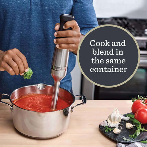 Total Kitchen Badass Five Speed Immersion Blender Bundle With Easy Swap Whisk And Rugged Storage Case 625 Watt Heavy Duty Hand Mixer uses blending in a stainless steel pot.
