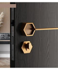 Top Shelf Interior Silent Door Lock Crafted From Premium Zinc Alloy Handle on black door with hexagonal design for smooth closure.