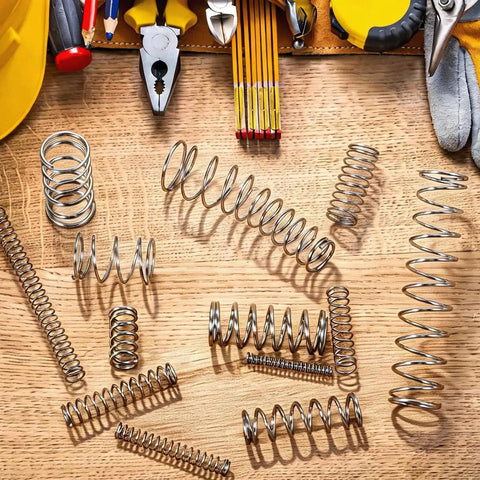 Durable Carbon Steel Compression Spring With 0.8mm Wire, 10mm Outer Diameter, And 300mm Length Perfect For Small DIY Repairs, Pen Fixes, And Home Shop Assortment Kits That Get Stuff Done Right Now, assorted springs on wooden workbench