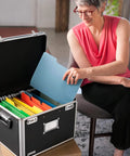 Person using a portable locking file box with dual combination lock for legal and letter size docs, big storage for tax returns.