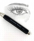 Black Mechanical Clutch Lead Holder Pencil For Butter Smooth Graphite Marking And Straight Fire Line next to a detailed eye sketch on dotted paper.