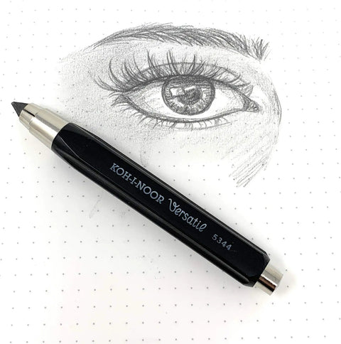 Black Mechanical Clutch Lead Holder Pencil For Butter Smooth Graphite Marking And Straight Fire Line next to a detailed eye sketch on dotted paper.