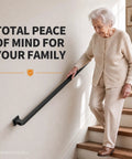 Rock Solid Black Wrought Iron Indoor Stair Handrail With Heavy Duty Square Tube Safety Railing And Sleek Matte Finish For Hallway Protection And No Sweat Diy Upgrades. Elderly person using sturdy handrail while descending stairs.