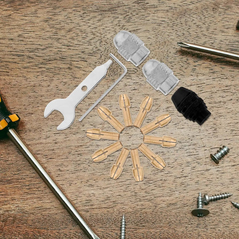 Sixteen Piece Drill Chuck Tool Kit with copper collets, wrenches, and nuts on wooden surface
