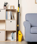 Commercial Dustpan With Windproof Cover For Indoor Outdoor Cleanup In Courtyard Garage Lobby Mall Market Floor Home Kitchen Office Pet Hair Garbage Heavy Duty Cleaning Tool For Quick Big Jobs shown in corner setup next to couch and shelves.