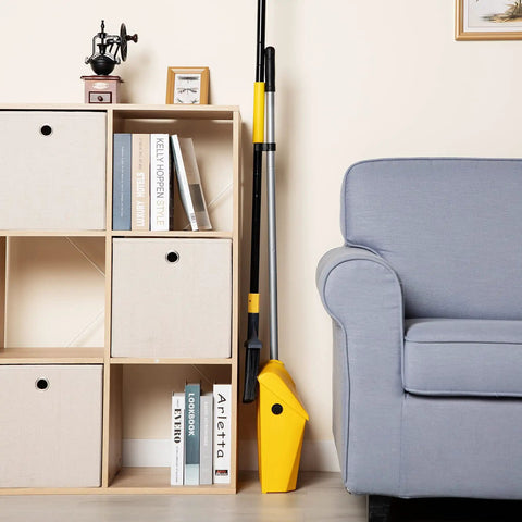 Commercial Dustpan With Windproof Cover For Indoor Outdoor Cleanup In Courtyard Garage Lobby Mall Market Floor Home Kitchen Office Pet Hair Garbage Heavy Duty Cleaning Tool For Quick Big Jobs shown in corner setup next to couch and shelves.