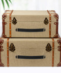 Two stylish linen trunks with modern leather handles featuring Two Leather Drawer Pulls With Mounting Screws Included for drawers.