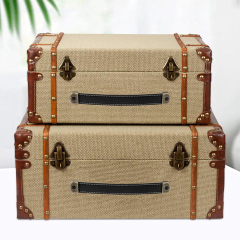 Two stylish linen trunks with modern leather handles featuring Two Leather Drawer Pulls With Mounting Screws Included for drawers.