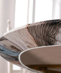 Close-up of round fitted tablecloth with elastic edge for indoor and outdoor use on 36 to 44 inch round tables, farmhouse style.