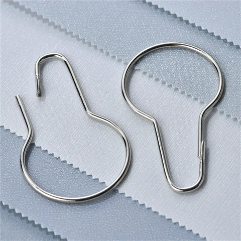 Smooth Glide Curtain Ring Set 60pcs With Hooks And Buckles For Rods shown on fabric background