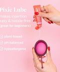 Pixie Lube being applied to Menstrual Disc Starter Kit With Medical Grade Silicone All Inclusive Set Includes Medium And Large Discs Applicator Lube Wash Sterilizing Carry Cup And Wipes For A No Mess Tampon Alternative Period Care